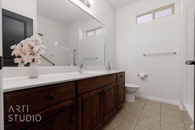 1109 N Ventana Dr, Washington, UT 84780 - full bathroom featuring tile patterned flooring, toilet, vanity, baseboards, and walk in shower