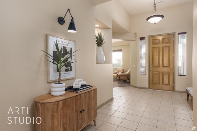 1109 N Ventana Dr, Washington, UT 84780 - foyer entrance featuring light tile patterned flooring and baseboards