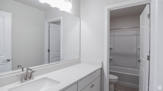 full bath featuring shower / bath combination, vanity, and toilet