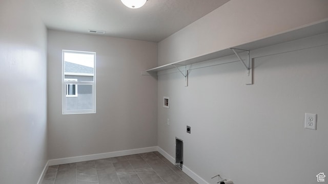 clothes washing area featuring laundry area, baseboards, visible vents, washer hookup, and electric dryer hookup