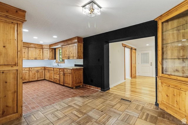 1417 E 700 S, Provo, UT 84606 - kitchen with a barn door, recessed lighting, a sink, visible vents, and light countertops