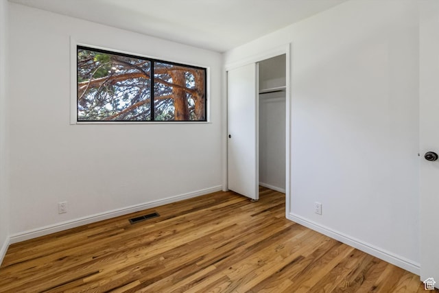 1417 E 700 S, Provo, UT 84606 - unfurnished bedroom with a closet, wood finished floors, visible vents, and baseboards