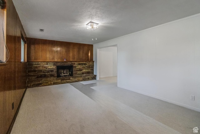 1417 E 700 S, Provo, UT 84606 - unfurnished living room with light carpet, wood walls, and a fireplace