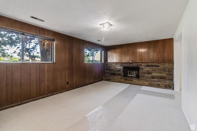 1417 E 700 S, Provo, UT 84606 - unfurnished living room featuring wood walls, a fireplace, and visible vents