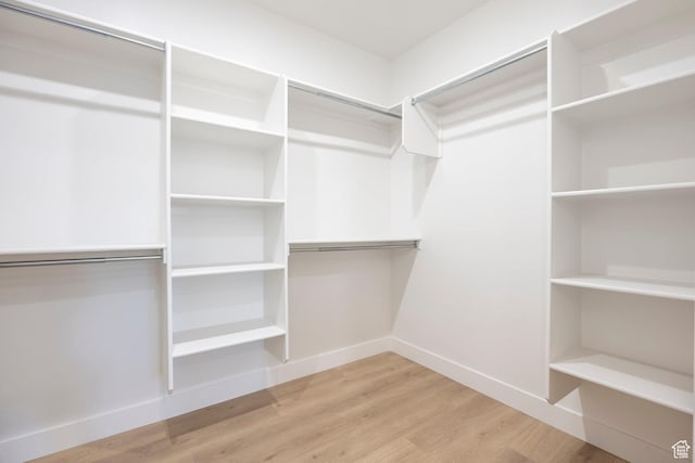 2250 E Murray Holladay Rd Unit 205, Holladay, UT 84117 - spacious closet featuring wood finished floors