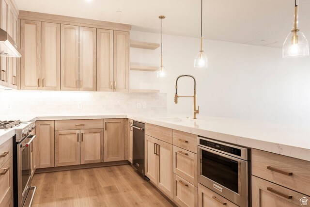2250 E Murray Holladay Rd Unit 205, Holladay, UT 84117 - kitchen featuring open shelves, a sink, light wood-style floors, appliances with stainless steel finishes, and light brown cabinetry