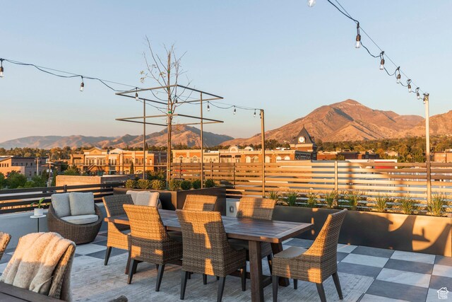 2250 E Murray Holladay Rd Unit 205, Holladay, UT 84117 - view of patio / terrace featuring outdoor dining space, fence, and a mountain view