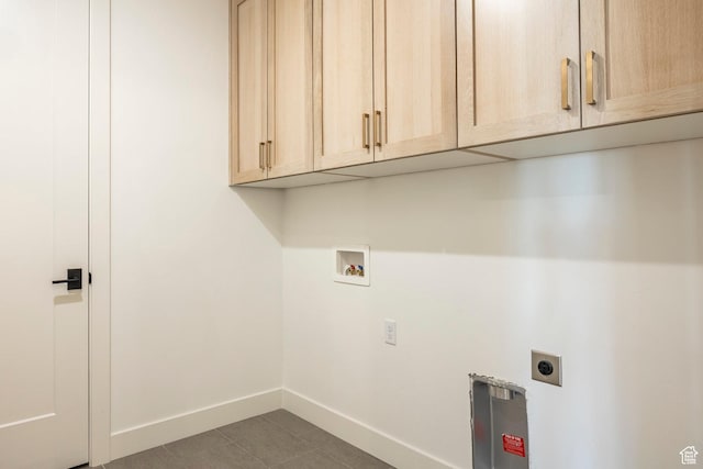2250 E Murray Holladay Rd Unit 205, Holladay, UT 84117 - clothes washing area featuring hookup for a washing machine, cabinet space, electric dryer hookup, and baseboards