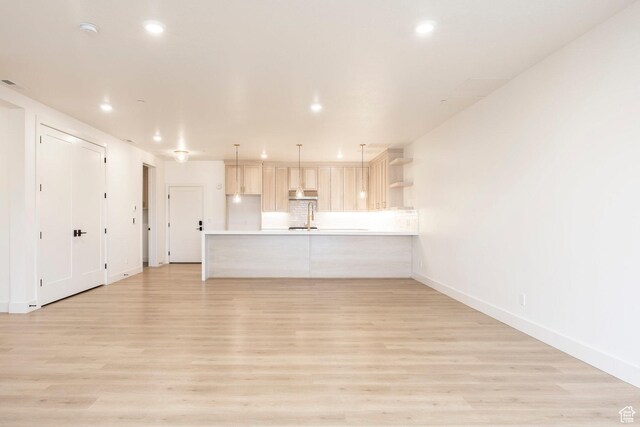 2250 E Murray Holladay Rd Unit 205, Holladay, UT 84117 - unfurnished living room with baseboards, light wood finished floors, and recessed lighting