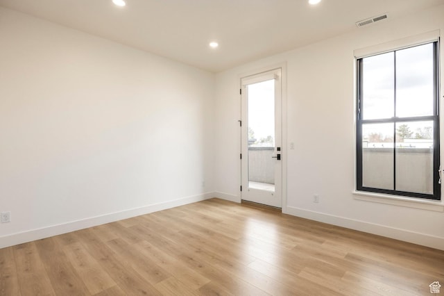 2250 E Murray Holladay Rd Unit 205, Holladay, UT 84117 - empty room featuring light wood-style flooring, visible vents, baseboards, and recessed lighting