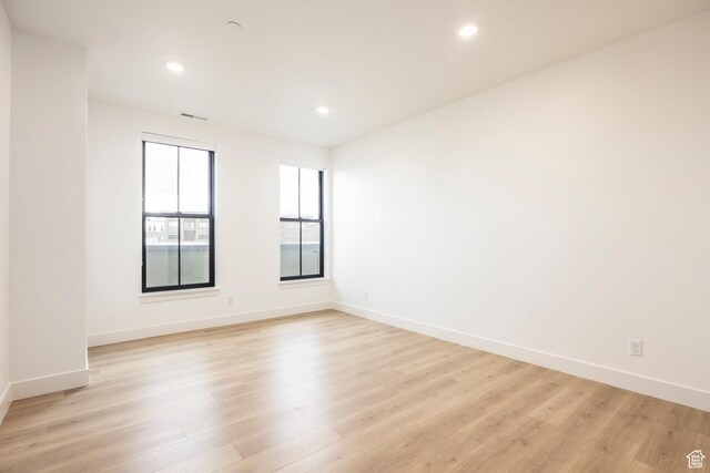 2250 E Murray Holladay Rd Unit 205, Holladay, UT 84117 - spare room featuring baseboards, light wood-type flooring, visible vents, and recessed lighting