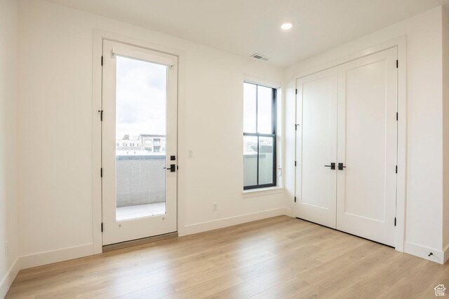 2250 E Murray Holladay Rd Unit 205, Holladay, UT 84117 - doorway featuring recessed lighting, baseboards, visible vents, and light wood finished floors