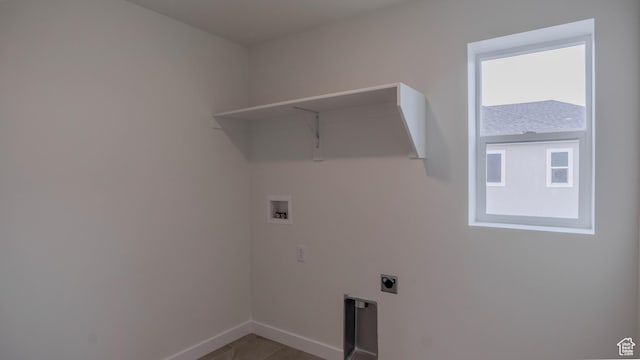 laundry room featuring electric dryer hookup, laundry area, baseboards, and washer hookup