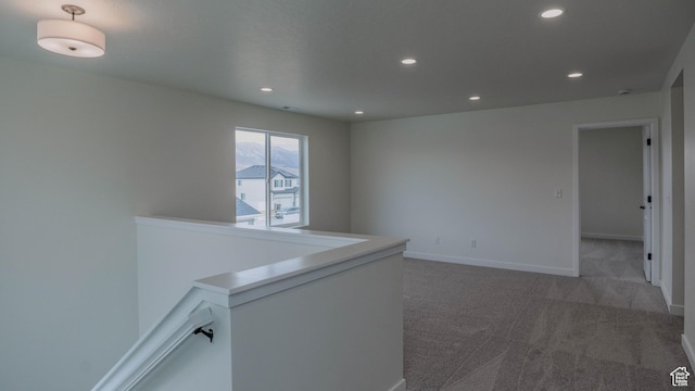 unfurnished room featuring recessed lighting, carpet flooring, and baseboards