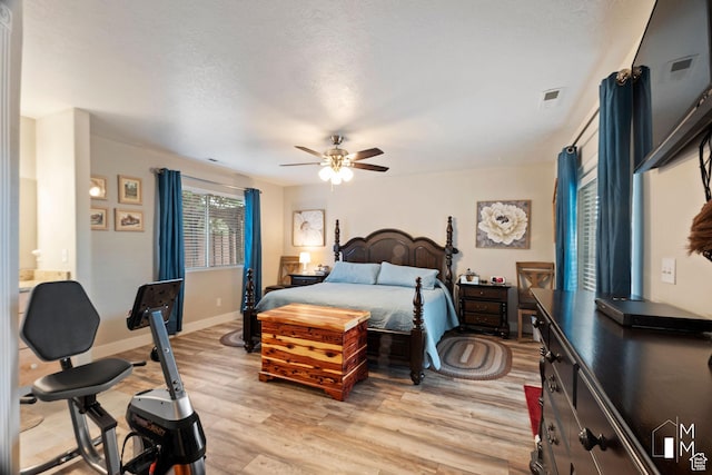657 W 150 S, Hurricane, UT 84737 - bedroom with visible vents, light wood-style floors, a ceiling fan, a textured ceiling, and baseboards