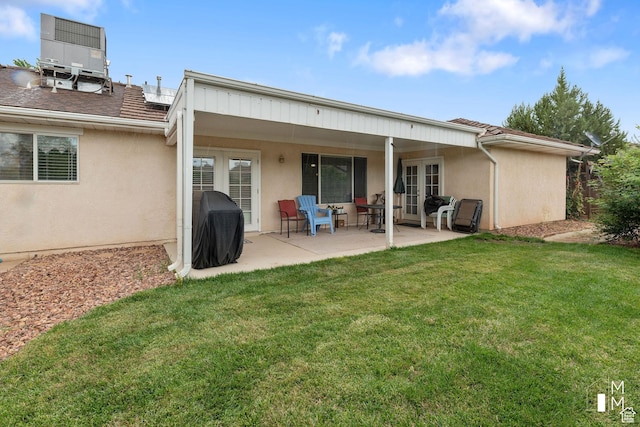 657 W 150 S, Hurricane, UT 84737 - rear view of property with a yard, central AC, french doors, and stucco siding