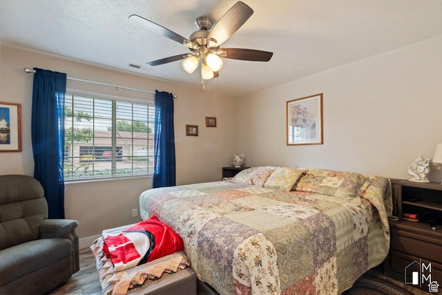 657 W 150 S, Hurricane, UT 84737 - bedroom featuring visible vents, ceiling fan, a textured ceiling, wood finished floors, and baseboards