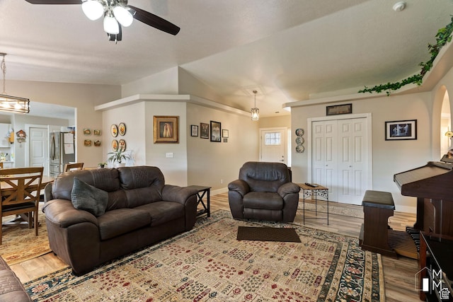 657 W 150 S, Hurricane, UT 84737 - living room with lofted ceiling, ceiling fan, wood finished floors, and baseboards