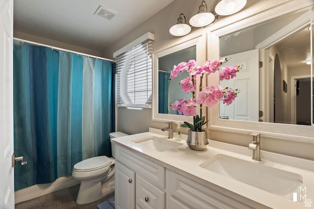 657 W 150 S, Hurricane, UT 84737 - bathroom with toilet, double vanity, a sink, and visible vents