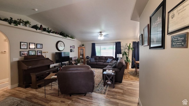 657 W 150 S, Hurricane, UT 84737 - living area featuring baseboards, arched walkways, lofted ceiling, ceiling fan, and wood finished floors