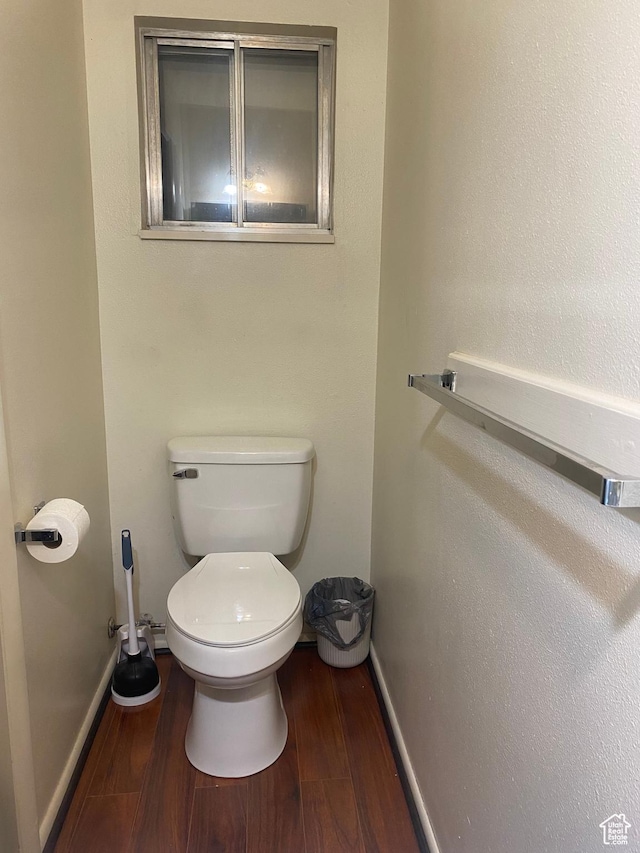 5980 S 9000 E, Jensen, UT 84035 - bathroom featuring wood finished floors, toilet, and baseboards