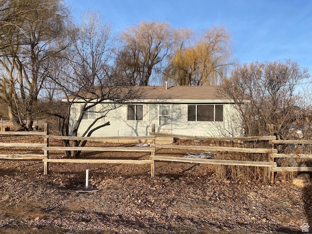 5980 S 9000 E, Jensen, UT 84035 - ranch-style house with a fenced front yard