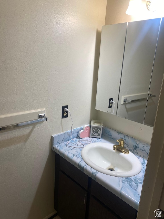5980 S 9000 E, Jensen, UT 84035 - bathroom with a textured wall and vanity