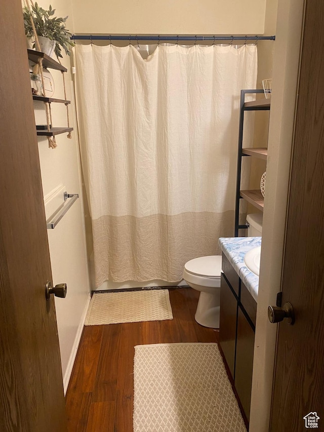 5980 S 9000 E, Jensen, UT 84035 - bathroom with toilet, wood finished floors, vanity, and baseboards