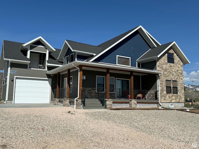 1595 S Bear Lake Blvd, Garden City, UT 84028 - view of front of home with a porch, stone siding, and an attached garage