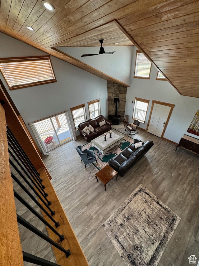 1595 S Bear Lake Blvd, Garden City, UT 84028 - unfurnished living room featuring wood ceiling, high vaulted ceiling, wood finished floors, and a wood stove