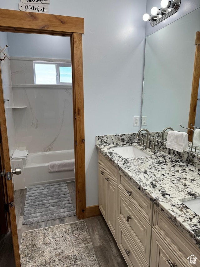 1595 S Bear Lake Blvd, Garden City, UT 84028 - full bath with wood finished floors, a sink, shower / bathtub combination, and double vanity