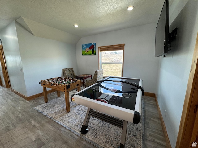 1595 S Bear Lake Blvd, Garden City, UT 84028 - playroom featuring lofted ceiling, baseboards, and wood finished floors