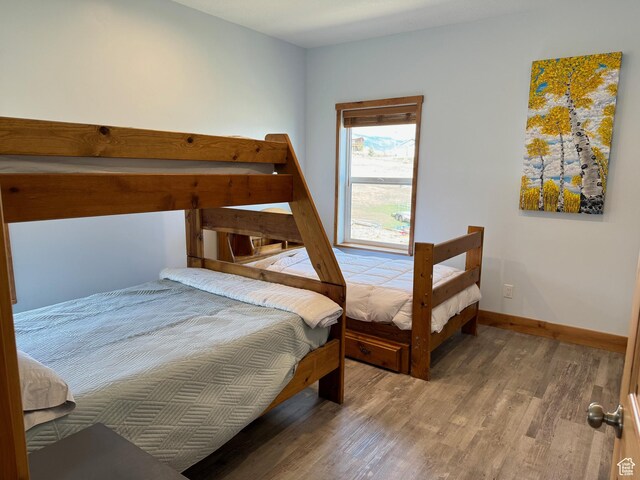 1595 S Bear Lake Blvd, Garden City, UT 84028 - bedroom featuring baseboards and wood finished floors