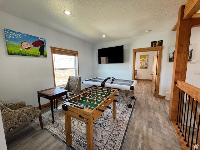 1595 S Bear Lake Blvd, Garden City, UT 84028 - recreation room featuring a textured ceiling, baseboards, wood finished floors, and recessed lighting