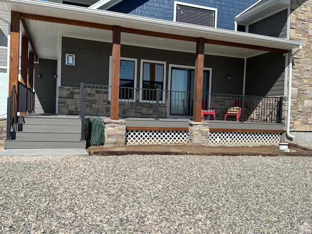 1595 S Bear Lake Blvd, Garden City, UT 84028 - doorway to property with stone siding and a porch