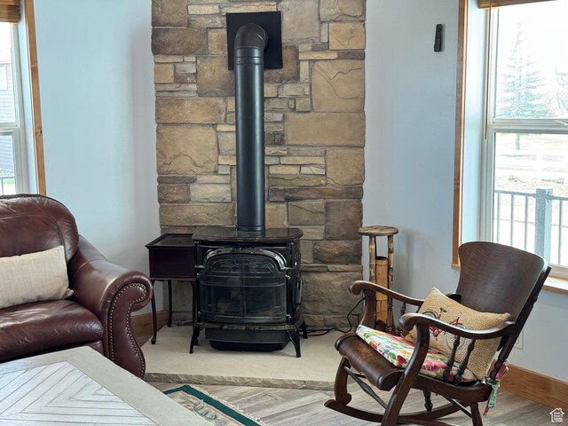 1595 S Bear Lake Blvd, Garden City, UT 84028 - living area featuring wood finished floors, a wood stove, and baseboards
