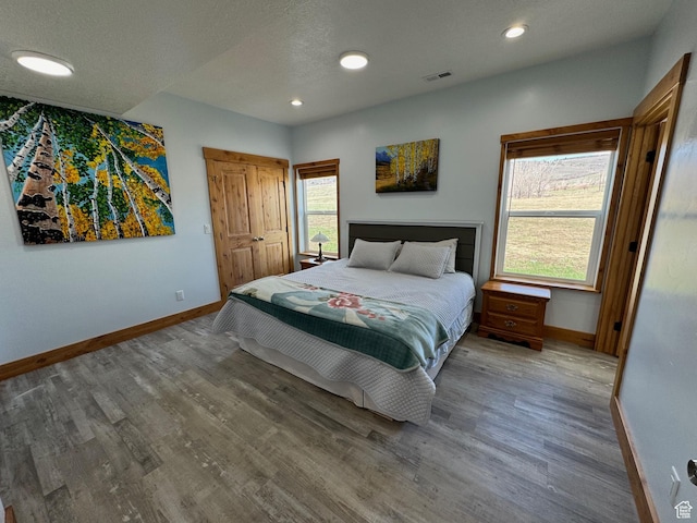 1595 S Bear Lake Blvd, Garden City, UT 84028 - bedroom with visible vents, baseboards, and wood finished floors