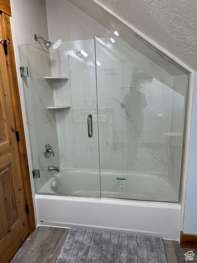 1595 S Bear Lake Blvd, Garden City, UT 84028 - bathroom with bath / shower combo with glass door and wood finished floors
