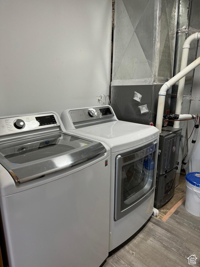 1595 S Bear Lake Blvd, Garden City, UT 84028 - laundry room featuring laundry area, wood finished floors, and washer and dryer