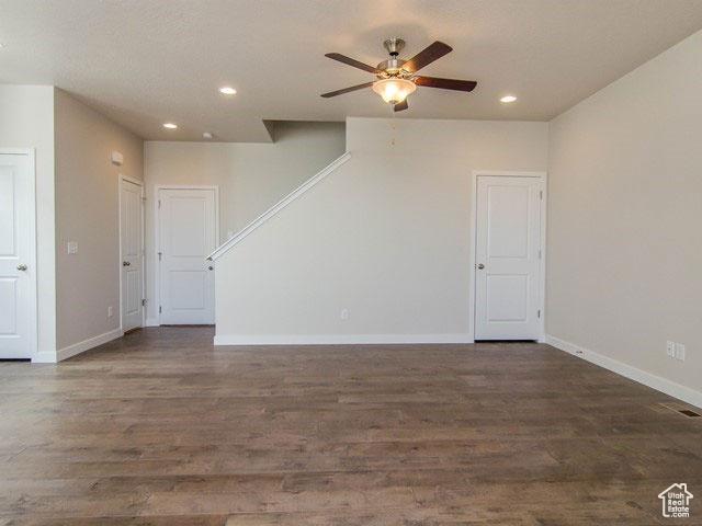 10053 N Torreya Dr Unit 733, Highland, UT 84003 - unfurnished room with dark wood-style floors, recessed lighting, stairway, and baseboards