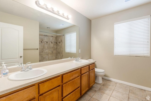 898 E Tendoy Ct S, Draper, UT 84020 - bathroom featuring a sink, toilet, double vanity, and tile patterned flooring