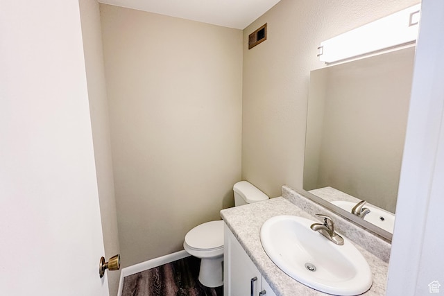 88 W 50 S Unit V-1, Centerville, UT 84014 - bathroom with visible vents, baseboards, toilet, wood finished floors, and vanity