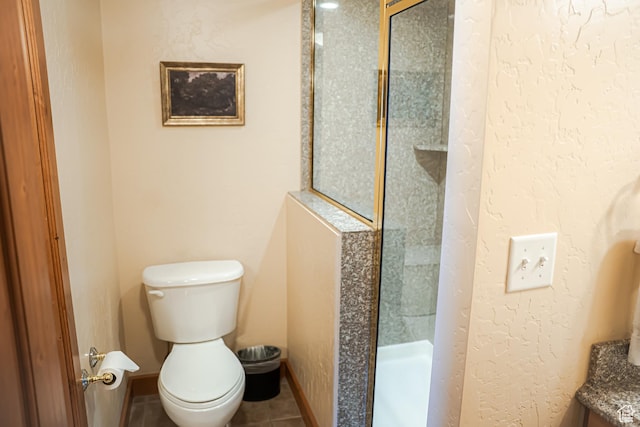 840 W Bigler Ln N Unit 3013, Midway, UT 84049 - full bath with a textured wall, toilet, baseboards, tile patterned floors, and a stall shower