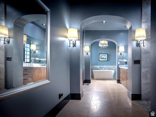 6153 E Last Monument Cir, Salt Lake City, UT 84108 - hall featuring arched walkways and baseboards