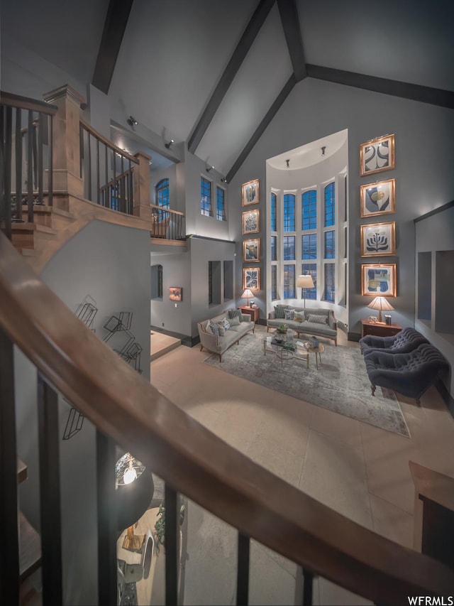 6153 E Last Monument Cir, Salt Lake City, UT 84108 - living room featuring beamed ceiling, tile patterned floors, high vaulted ceiling, and stairway