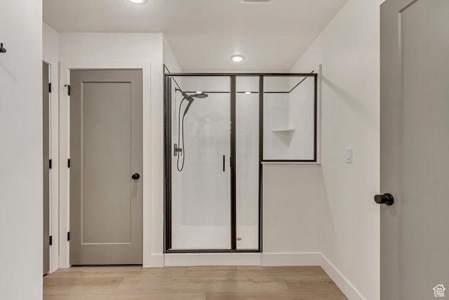 interior space featuring light wood-style flooring and baseboards