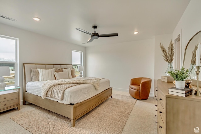 bedroom with recessed lighting, visible vents, light carpet, baseboards, and ceiling fan