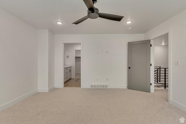 unfurnished bedroom with light colored carpet, baseboards, visible vents, and recessed lighting