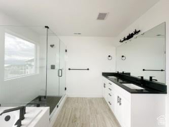 5644 W 7340 S, West Jordan, UT 84081 - full bath with a shower stall, wood finished floors, and double vanity