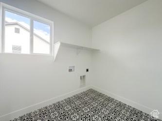 5644 W 7340 S, West Jordan, UT 84081 - clothes washing area featuring hookup for an electric dryer, hookup for a washing machine, baseboards, and tile patterned floors